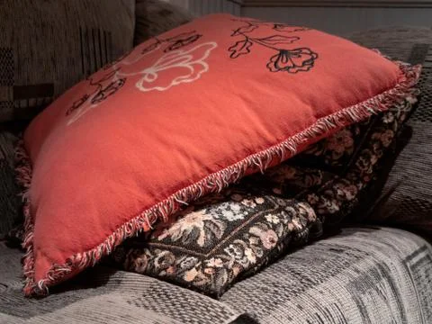 View of red pillow on gray sofa Stock Photos