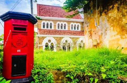 View on red post box in front of All Saints Anglican church in Galle, Sri Lanka Stock Photos