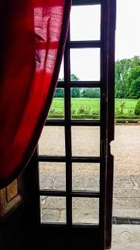 View of the regular Park through a window with bars. Summer Stock Photos