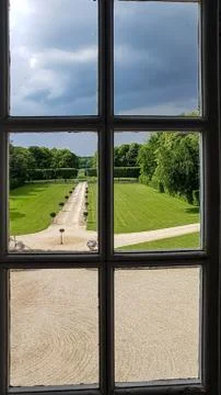 View of the regular Park through a window with bars. Summer Stock Photos