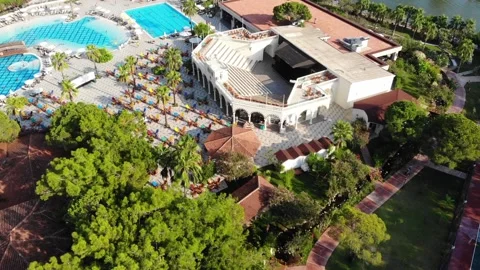 View on resort hotel area with pool, lounge chairs and bar Stock Footage 172446509