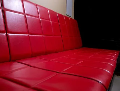 View on a retro red sofa Stock Photos