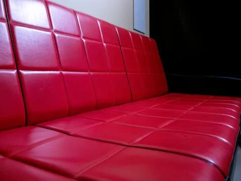View on a retro red sofa Stock Photos