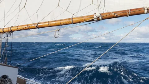View from a retro style sailing schooner during the passage of the Drake Strait Stock Footage 265091825