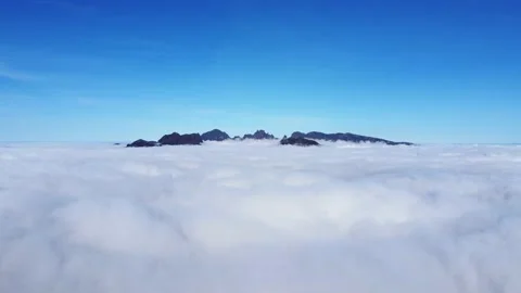 View from Ribeira Brava of the windmills and in the distance the highest mountai Stock Footage 181038049