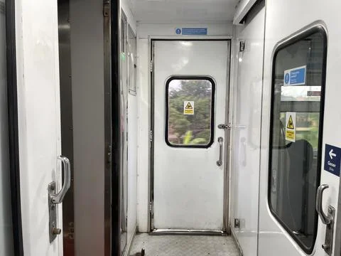 View of the rice fields from the box window at the train door Stock-Fotos