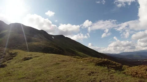 View from right to left green hills of the highlands and the bright mountain sun Stock Footage 40699388