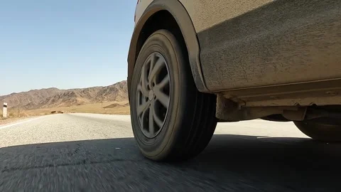 View of the right rear wheel of an off-road vehicle in motion Stock-Footage 241380604