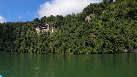 View of Rio Dulce river with rocky shores covered with rainforest, Guatemala Video stock 242764112