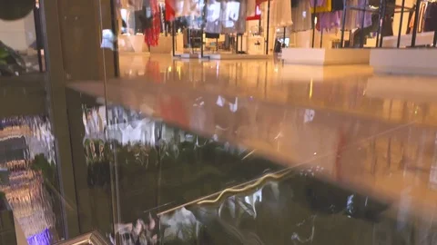 View from rising glass elevator in a modern shopping mall. 4K video Stock Footage 73927982