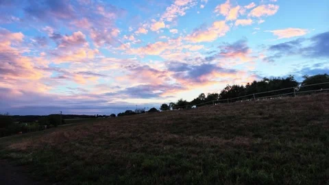 View Rising From Paved Path Across Rural Field Stock Footage 345654530
