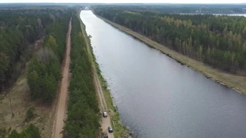 View of a river and forest area in an open landscape capturing nature's layout a Stock Footage 328998529
