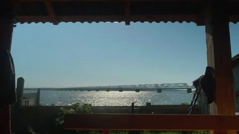 View of river and huge bridge over it. Sunny summer day in Russian village. Stock Footage 140670795