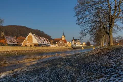 View of river and old town with church in winter Stock Photos