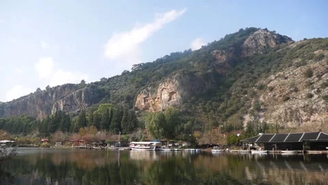 View Of The River And Rocks With Famous Ancient Lycian Tombs (Kaunos, Turkey) Stock Footage 195987855