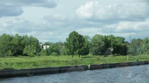 View of the river bank from passing ship Stockbeeldmateriaal 35717442