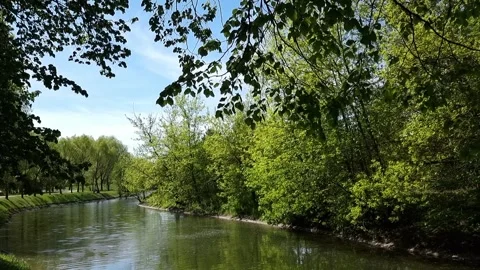 View of the river in the city park, Belarus. Atmospheric spring landscape Stock Footage 309302385