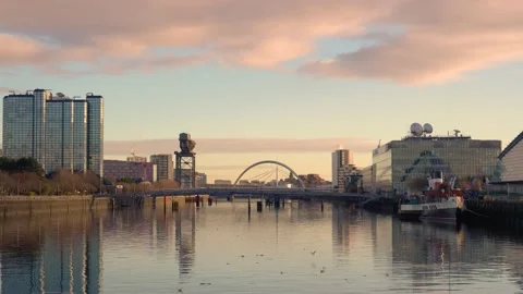 View on River Clyde towards Glasgow, Stobcross Crane and Glasgow Arc bridge Stock Footage 228929441