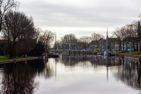 View of the river De Vecht in Weesp with old bridge Stock Photos