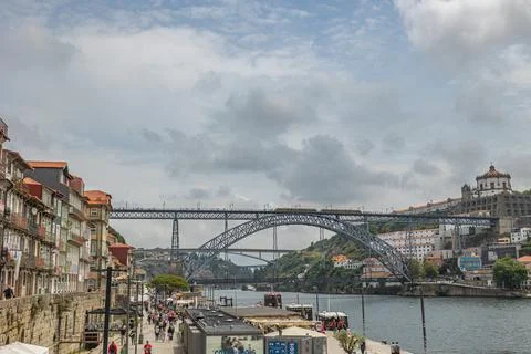 View of the river Douro, the Dom Luis Bridge, the old city of Porto and the cais Stock Photos