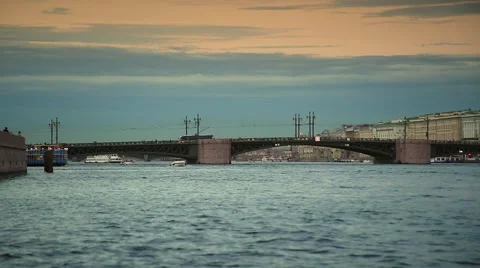View from the river to the Dvortsoviy Bridge, St. Petersburg, Russia. Sunset Stock Footage 53022406