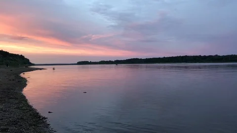 View of the river in the evening. Pink sunset on the river in summer Stock Footage 100561595