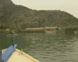 View of river from front of moving boat as it approaches cliff tombs SD Footage