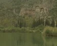 View of river from front of moving boat as it approaches cliff tombs SD Footage