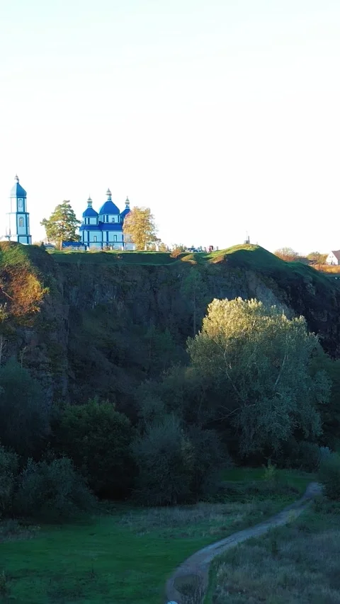 View of the river from the hill on which the church stands. Vertical video. 스톡 동영상 288219706