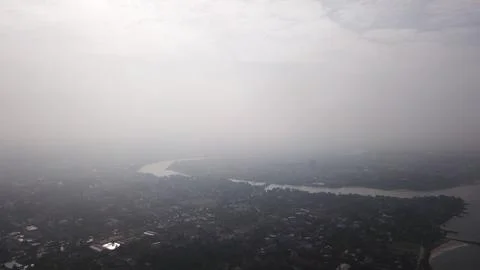 View of a river on a misty day Stock Photos
