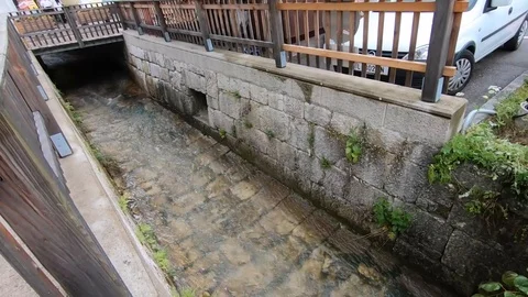View of river stream in hallstatt city that falls into lake Video stock 114378264