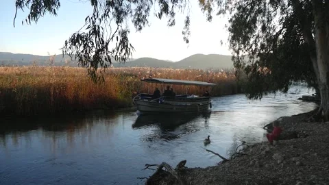 View Of The River With A Strong Current And A Floating Motor Boat Stock Footage 195980438