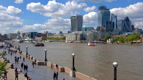 View of the River Thames walkway and city buildings in London Stock Footage 108553461