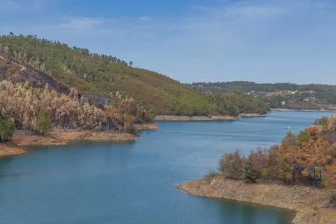 View to the river from the Tomar mountain range. with Burnt Forest. Stock Photos
