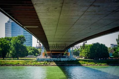 View of the river under the bridge. View of the bridge from below the river o Stock Photos