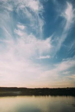 The view of the river under the cloudy sky. Stock Photos