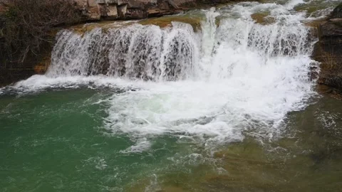 View of the river with waterfall and blue water Stock Footage 303606190