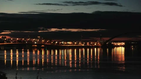 View of the river which reflects the lights of the city. Video stock 132729422