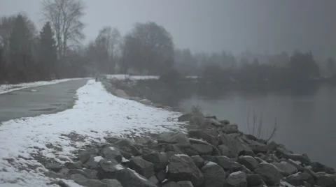 A view of a river while it is snowing Stock Footage 59131780