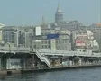 View of riverside city, bridge and and Galata Tower filmed from boat SD Footage