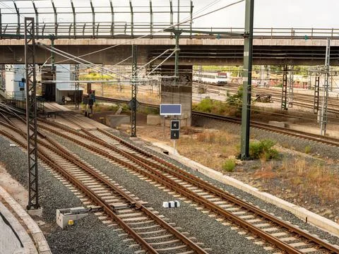 View on a road bridge passing over the railways at a cloudy day Stock Photos