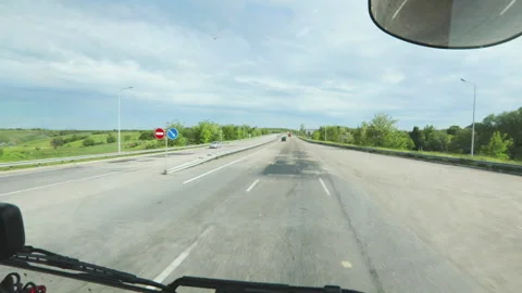 View of the road from the cab of the truck. View of the highway from the cab of 스톡 동영상 167609064