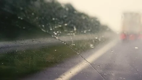 View of the road from the car in the rain. Focus on the windshield. The road is Stock Footage 78138766