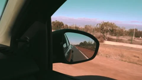 The view of the road from the car window to the rearview mirror while driving. Stock Footage 303967451