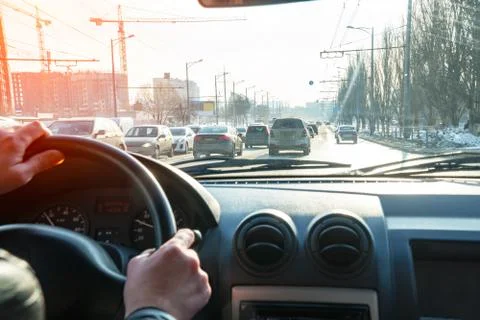 View of the road in the city through the windshield of the car Stock Photos