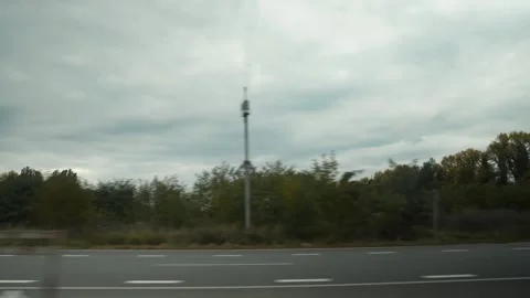 View of the road, field and trees from inside the car  Stock Footage 253502594