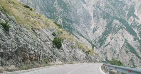 View of the road in the mountains through the windshield of the car. Serpentines 스톡 동영상 170326204