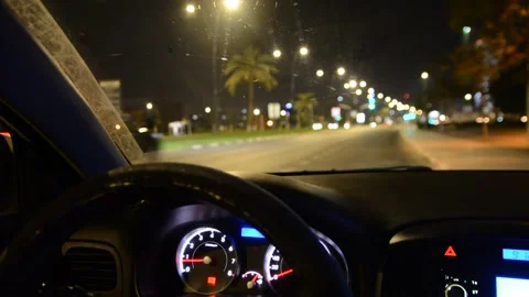 View of the road at night from the car the dashboard lights up Stock Footage 134328029
