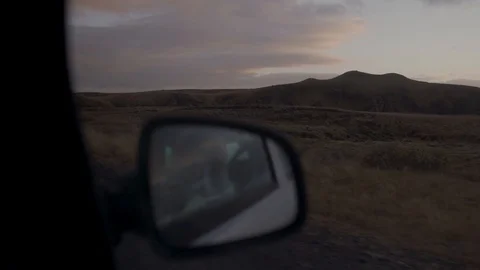 View of the Road in the Rearview Mirror of  Sunset in Iceland. Stock Footage 102950273