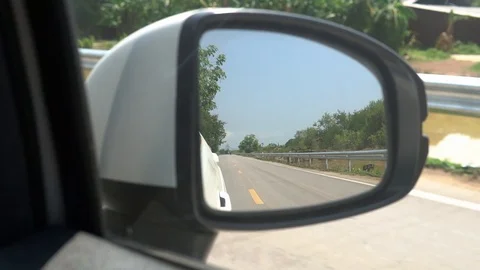 View of the road in the side mirror of the car Stock Footage 108527922